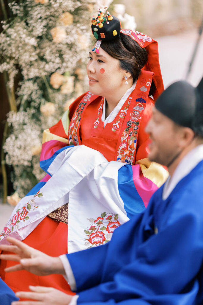 Korean wedding Tea Ceremony with bride and groom in traditional attire.