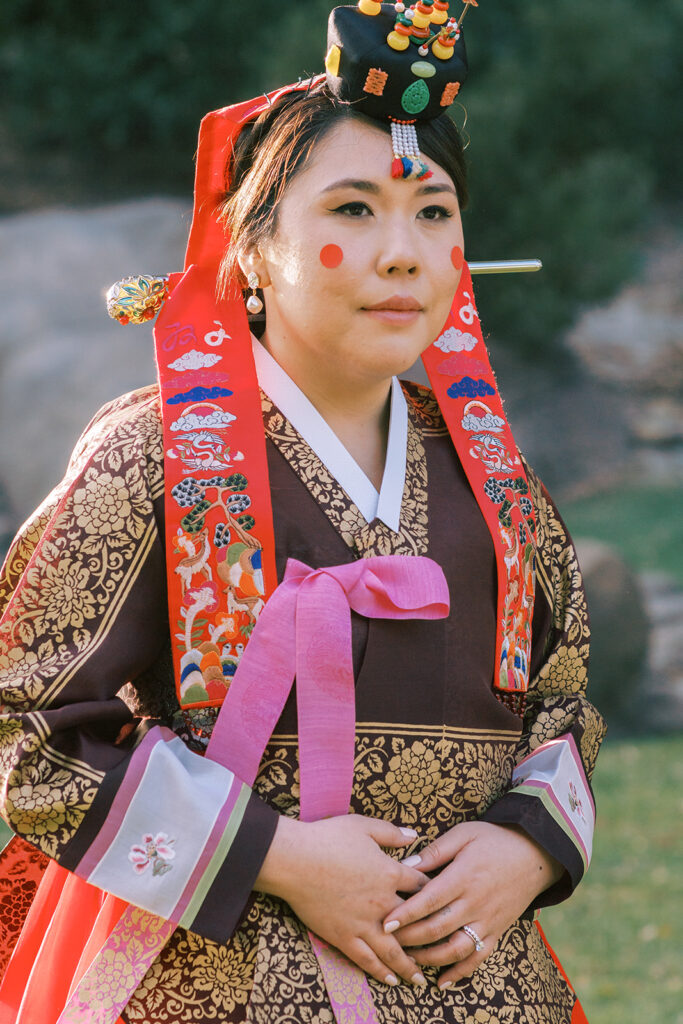 Korean wedding Tea Ceremony with bride and groom in traditional attire.