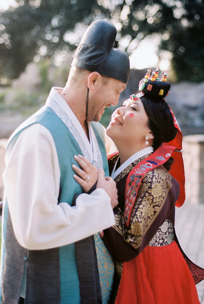 Korean wedding ceremony with bride and groom in traditional attire.