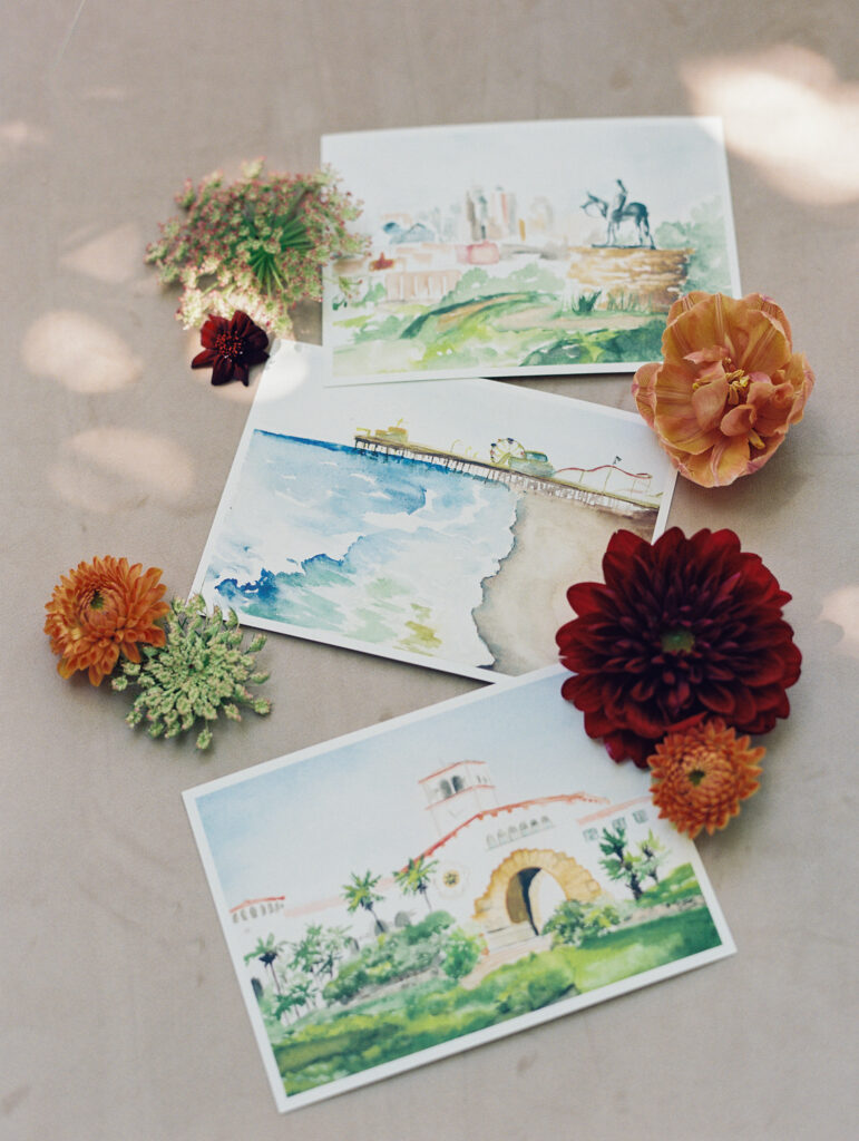 Wedding Seating chart with watercolored landscape postcards and vellum envelopes as escort cards. 