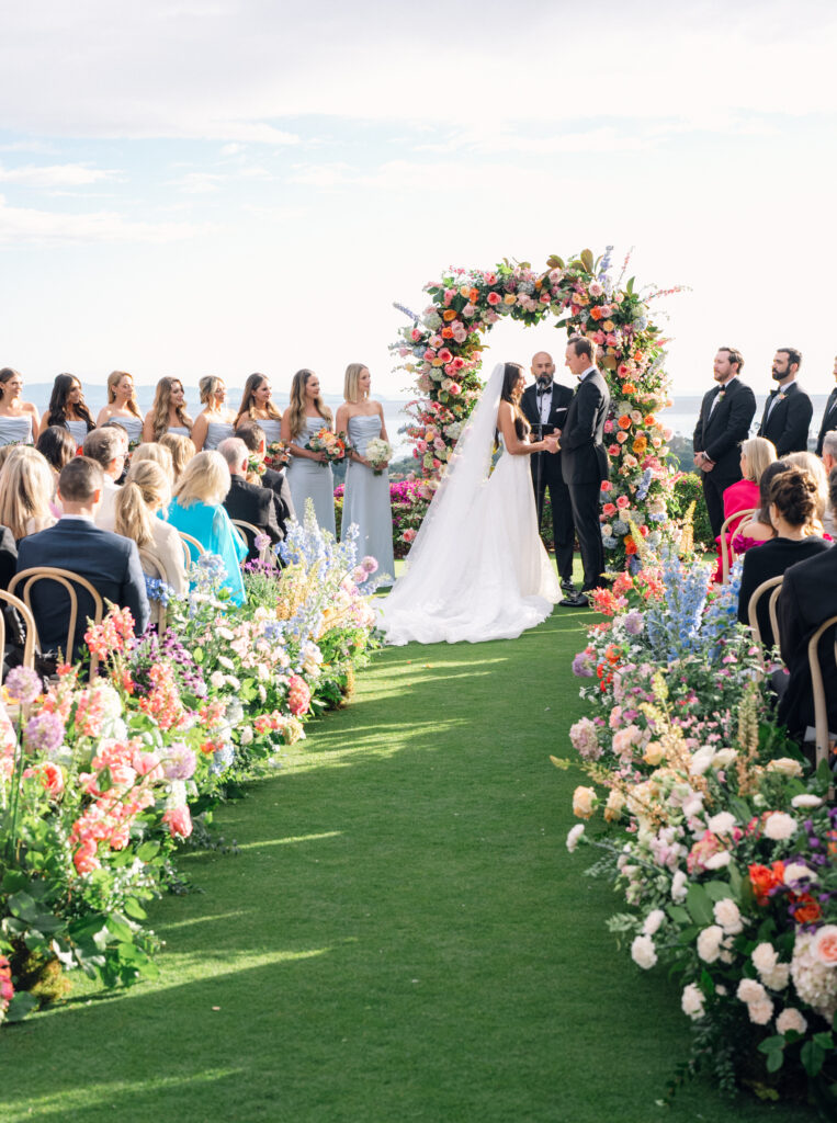 Colorful Floral-filled Wedding Ceremony at The Montecito Country Club with ocean view