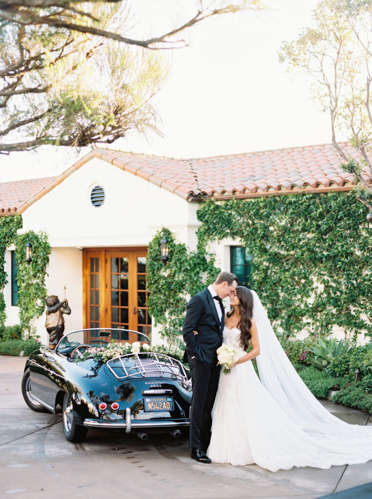 Bride and Groom portrait outside Montecito Country Club with vintage car