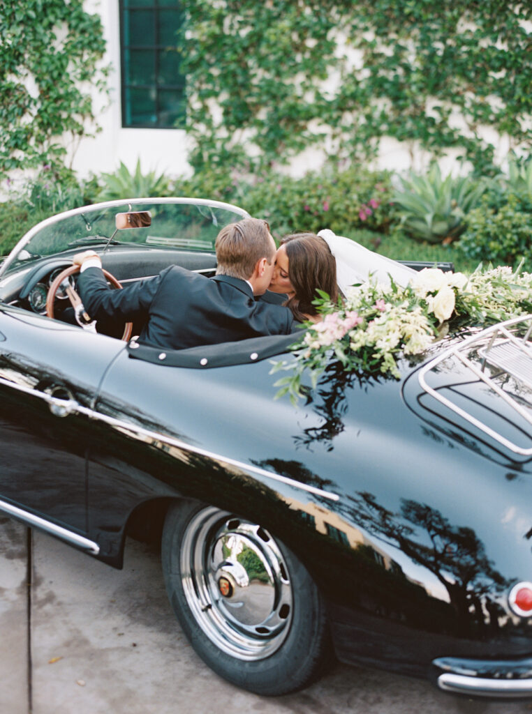 Bride and Groom portrait outside Montecito Country Club with vintage car