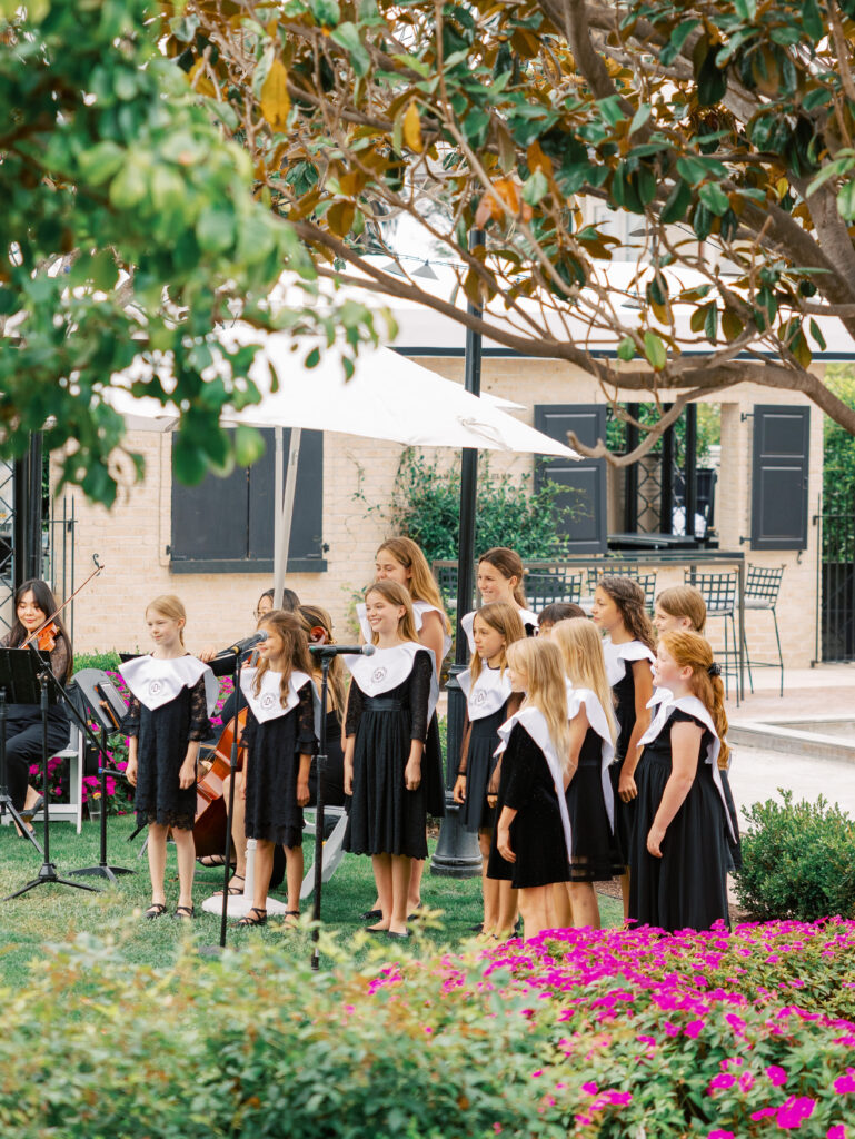 Children's choir singing during wedding ceremony at the Rosewood Miramar Beach Resort