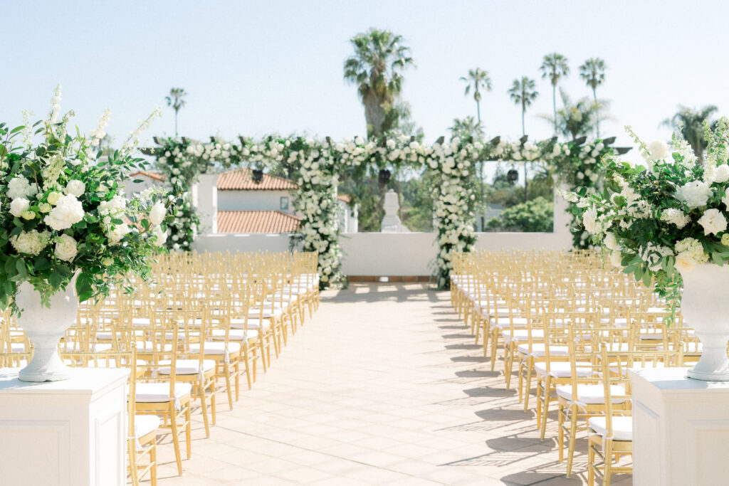 Triple wedding arch at Hotel Californian Sirena Rooftop with white flowers