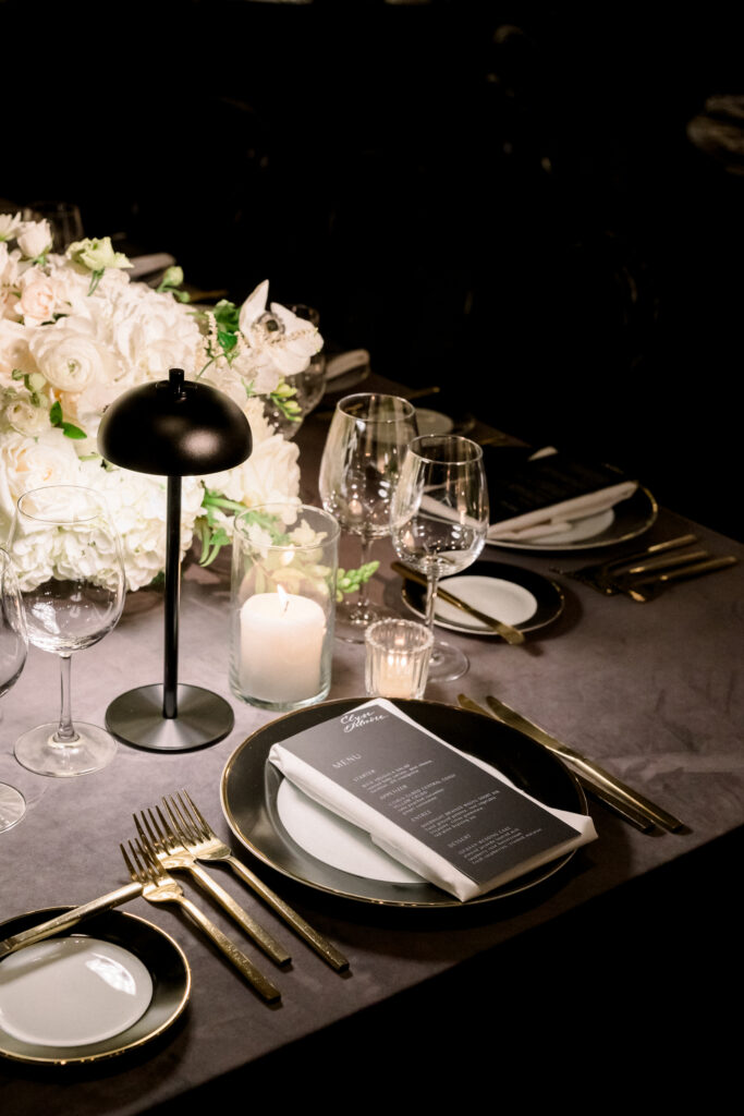 wedding reception tablescape with black lamps