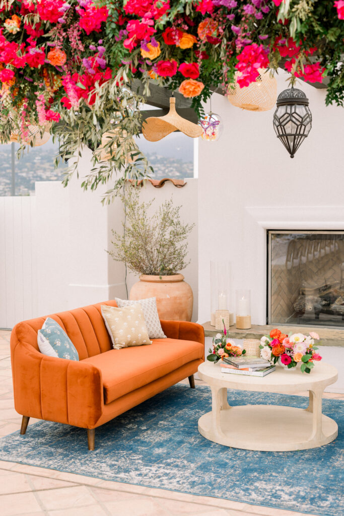 Colorful lounge with fun lighting and floral installation overhead at Hotel Californian in Santa Barbara, Ca. 