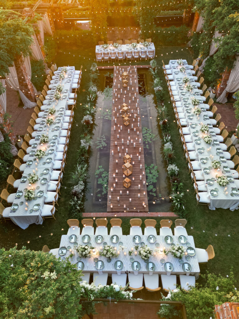 Drone shot of outdoor wedding reception at Belmond El Encanto at the Lily pond