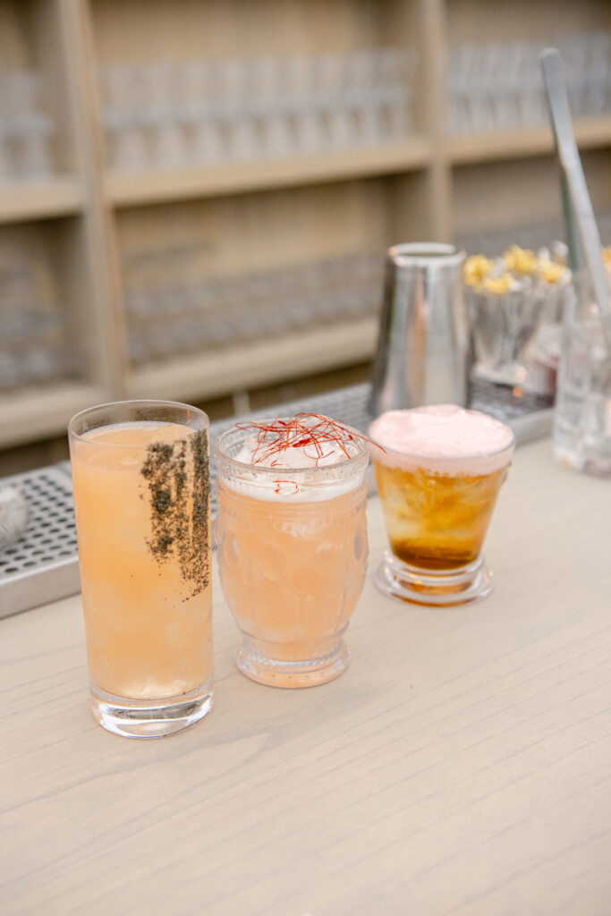 Signature cocktails on bar for Kentucky Derby party including a mint julep