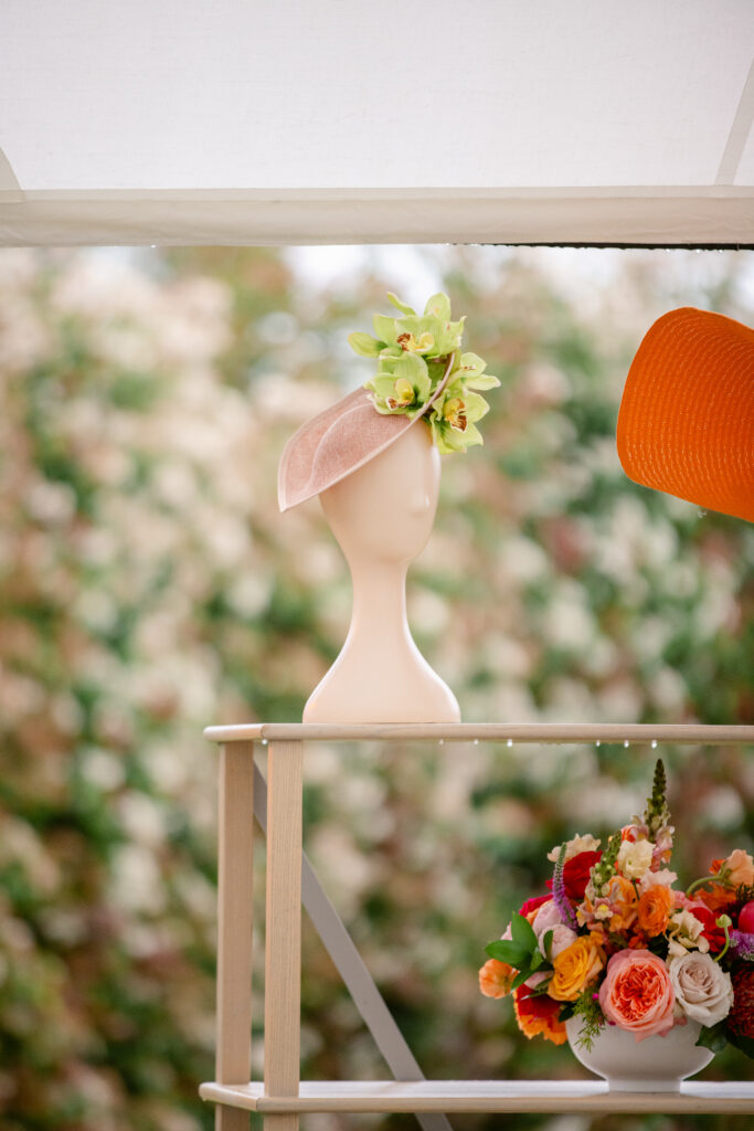 Handmade Kentucky Derby Hats on display on shelf at Kentucky Derby party.