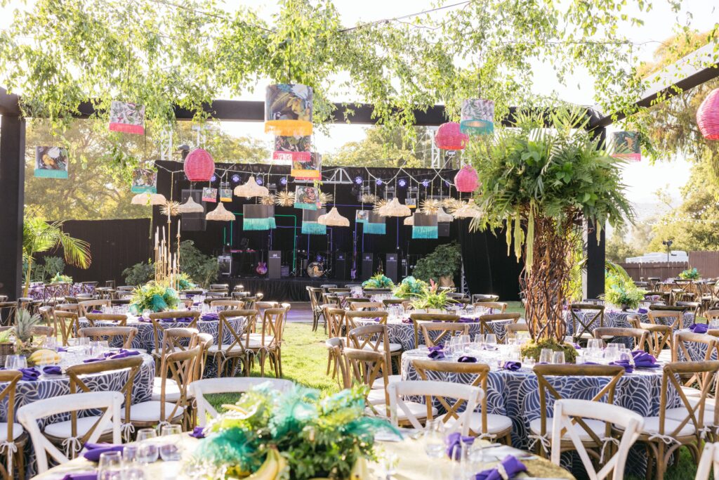 Gucci Jungle Themed Party with black structure, and custom lighting, greenery overhead