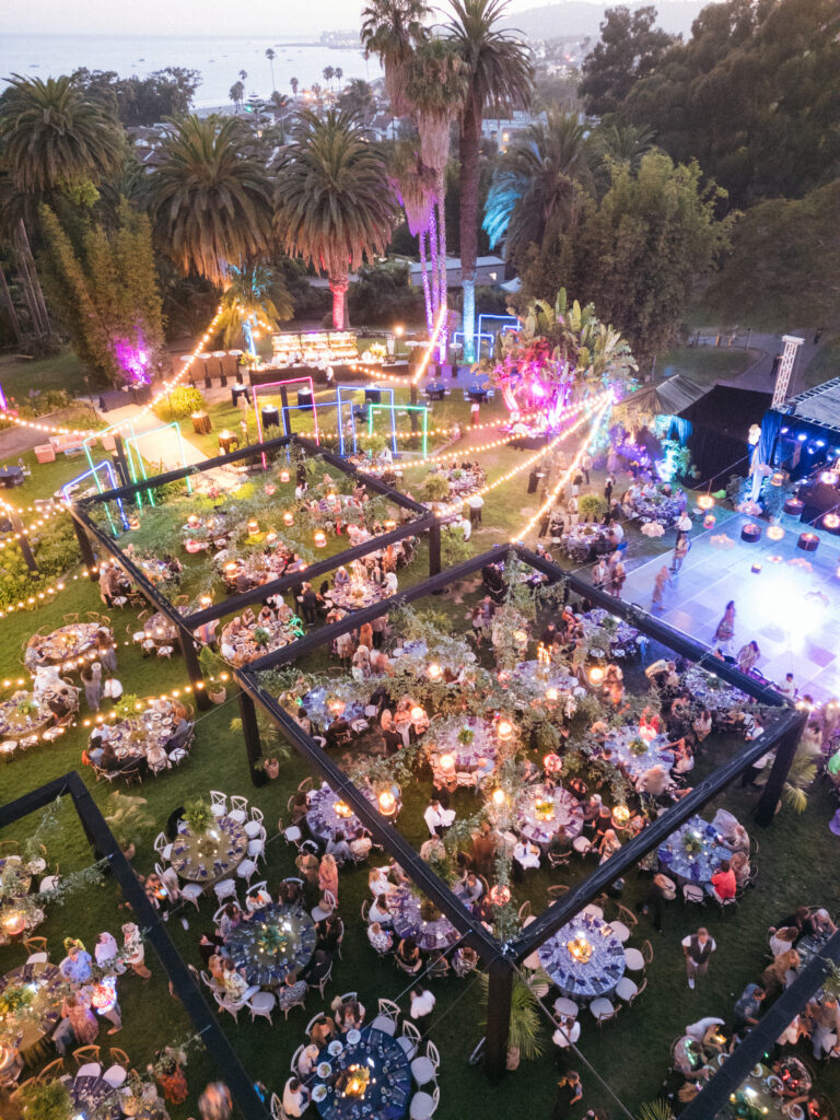 Drone photo of Gucci Jungle themed party in Santa Barbara with large black structures and colorful lighting