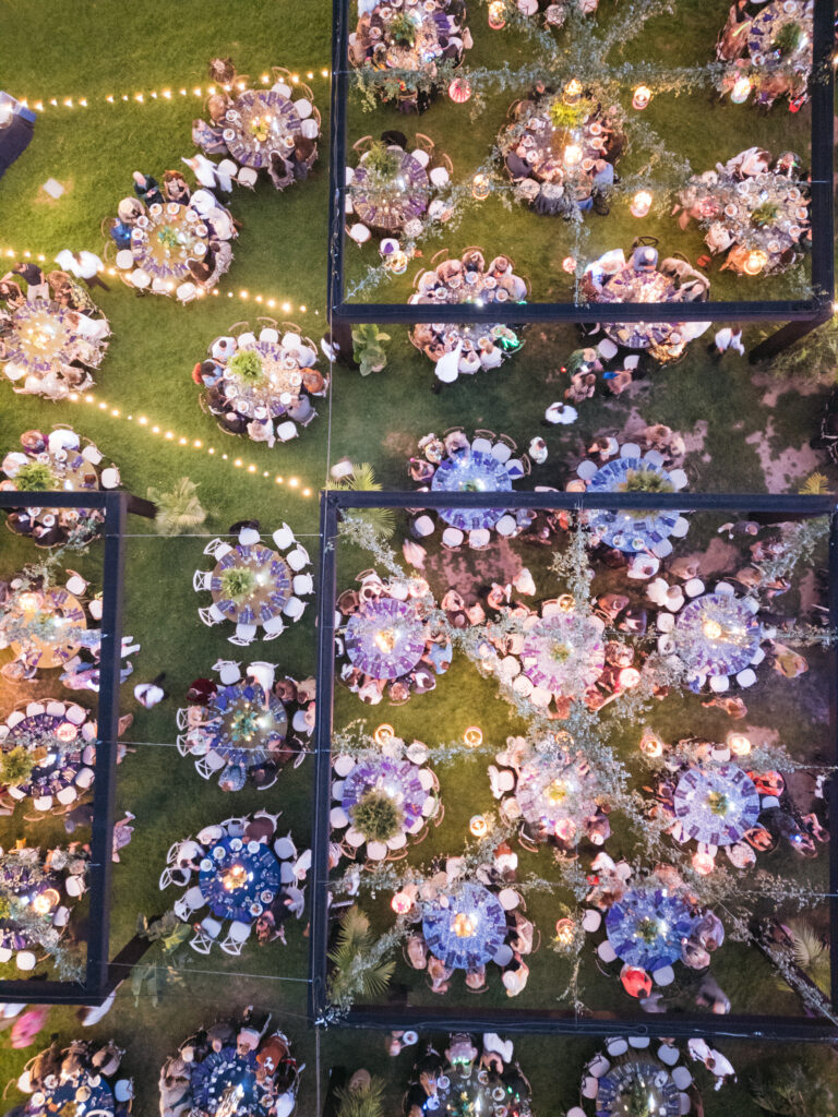 Drone shot of black structures over tables at Gucci Jungle Themed Party