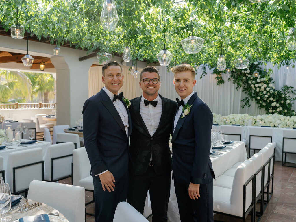 Tyler Speier with two grooms at wedding
