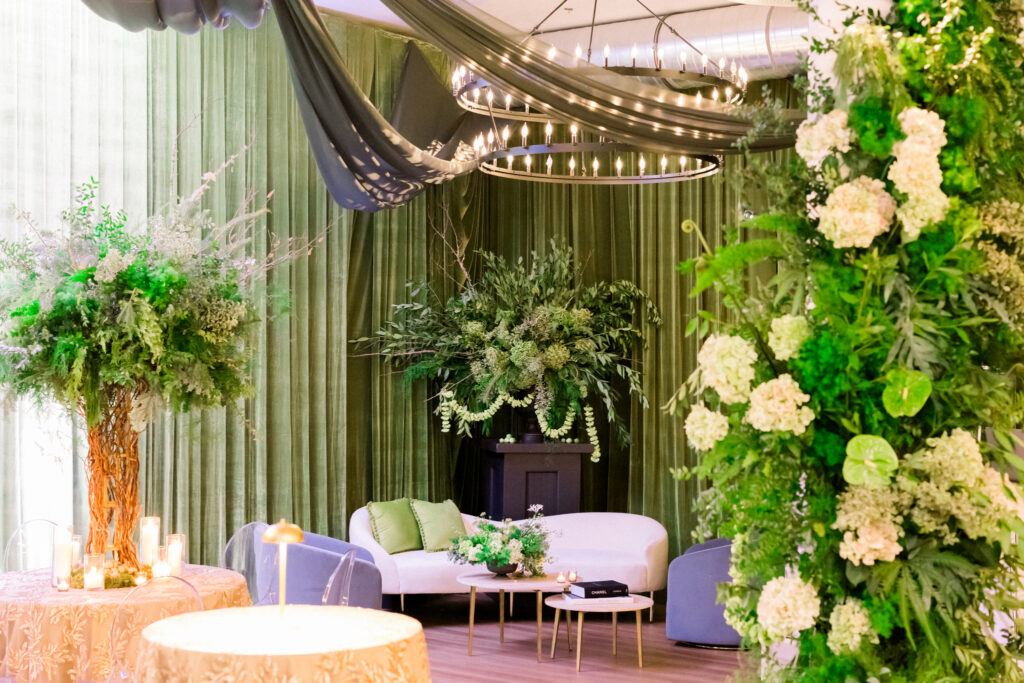 Wicked musical themed party with dramatic green florals and draping