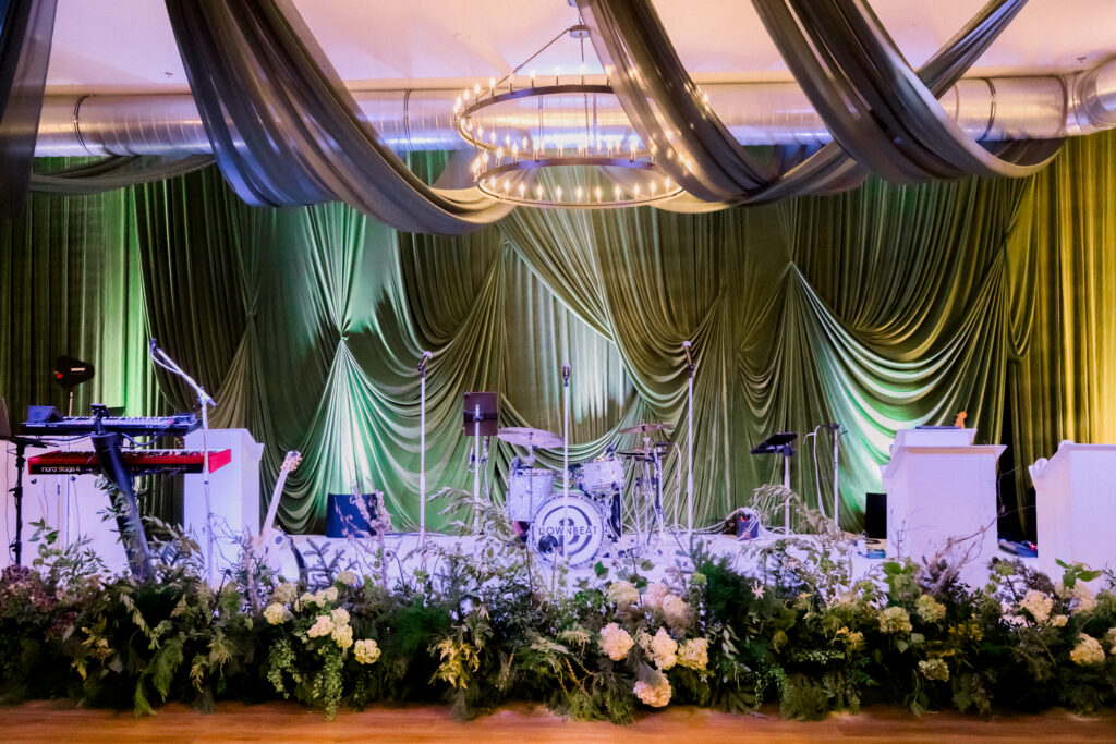 Wicked musical themed party with dramatic green draping