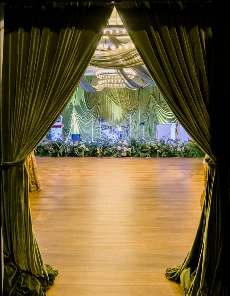 Wicked musical themed party with dramatic green draping