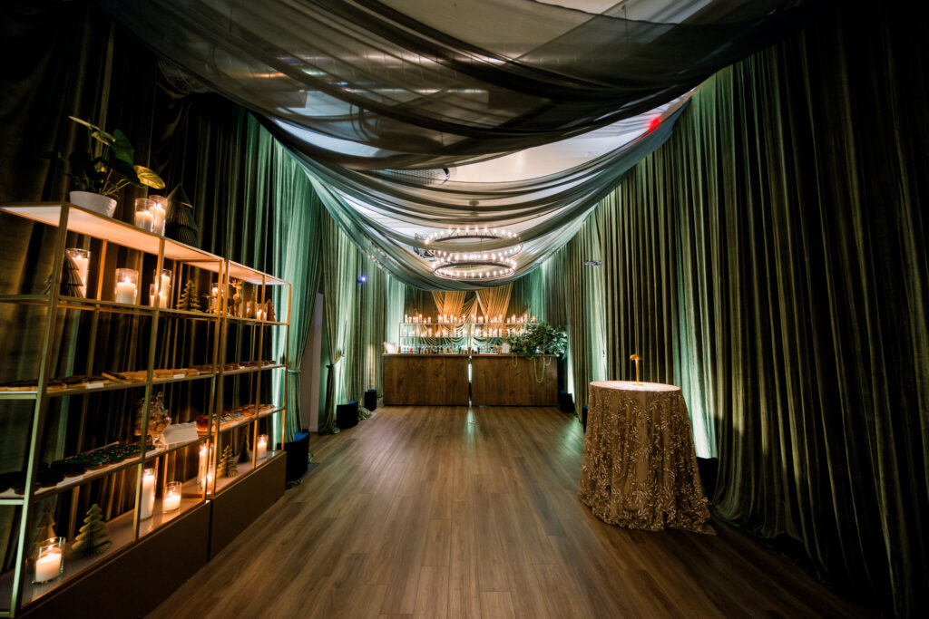 Dramatic Green velvet draping at corporate party