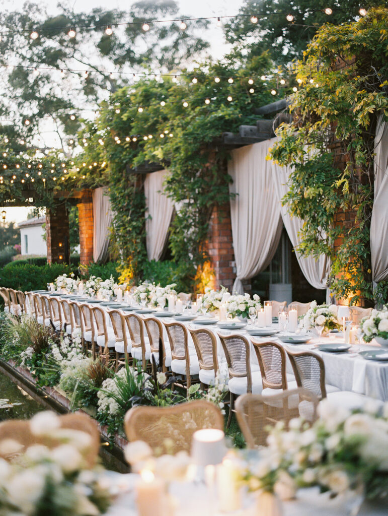 Quiet luxury wedding reception at Belmond El Encanto lily pond 