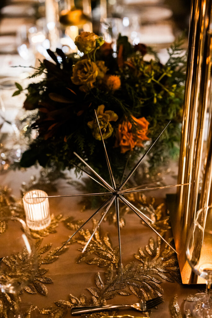 Corporate Holiday party tablescape with gold sequin linens